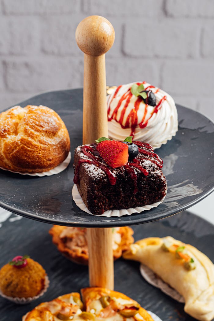 services-bg A selection of delicious pastries displayed on a tiered stand, perfect for dessert lovers.